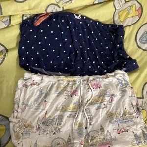 The shorts with the dots is size L and the other one pastel buildings size XL